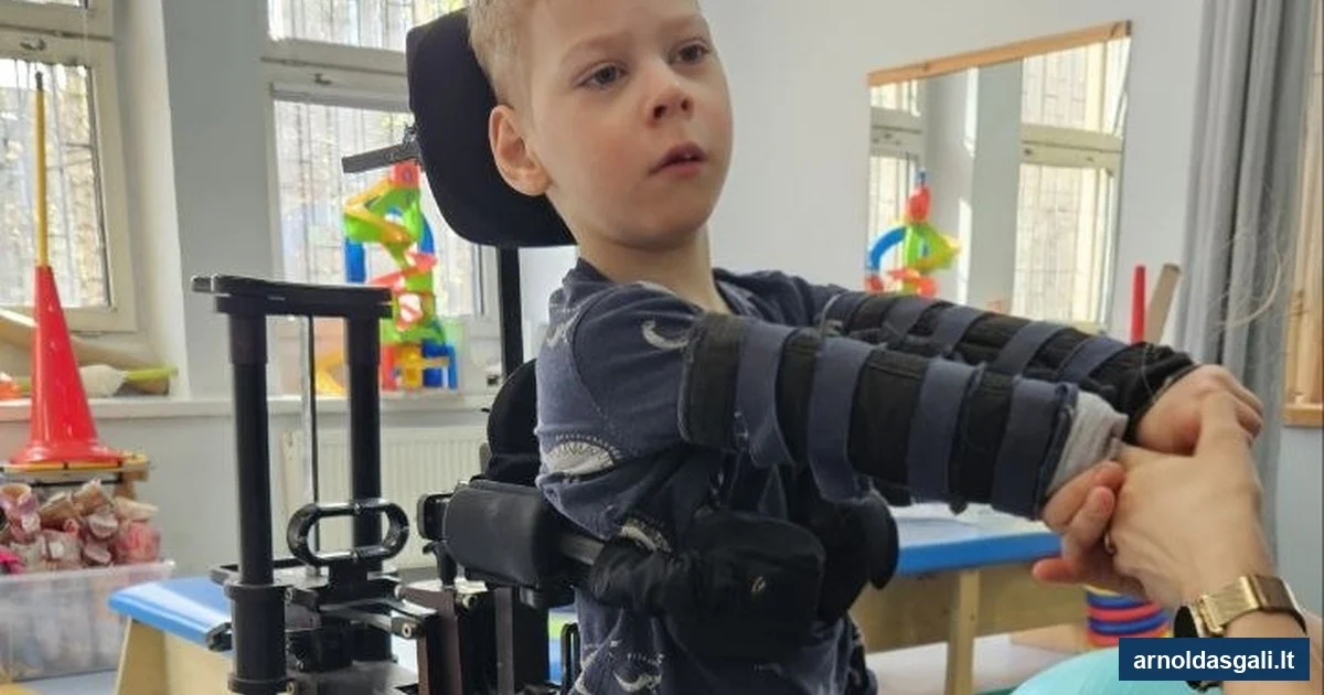 Arnoldas vertikalizatoriuje užsiėmimo metu